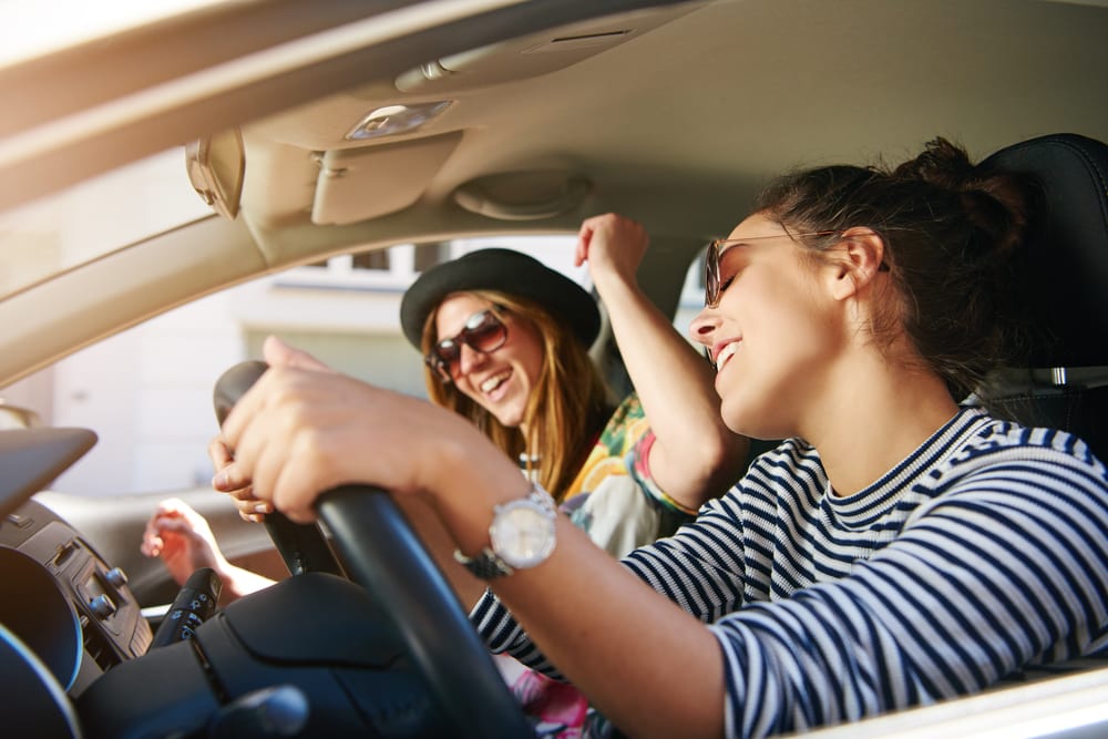 girls singing whilst driving to festival