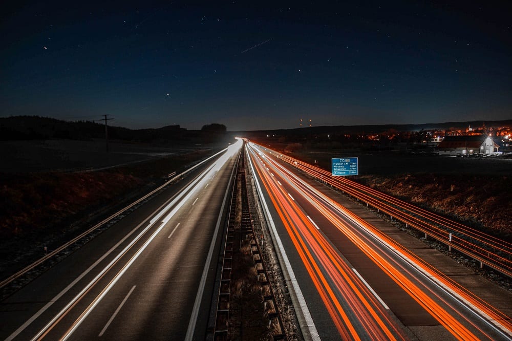 Car lights on autobahn at night