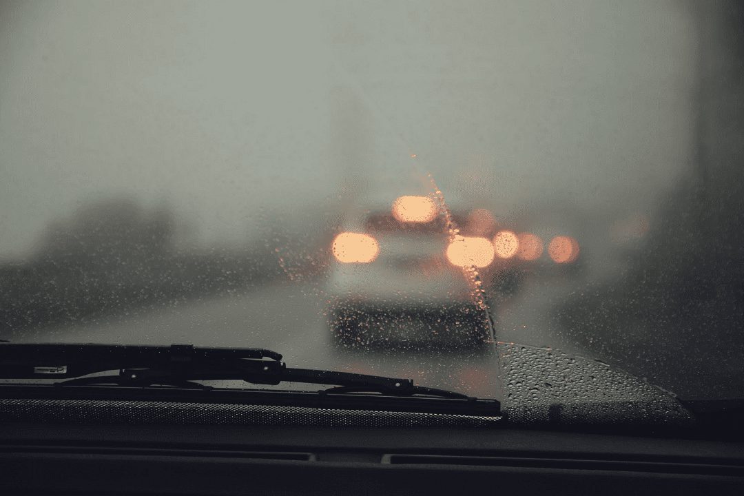 Car driving in the rain in winter