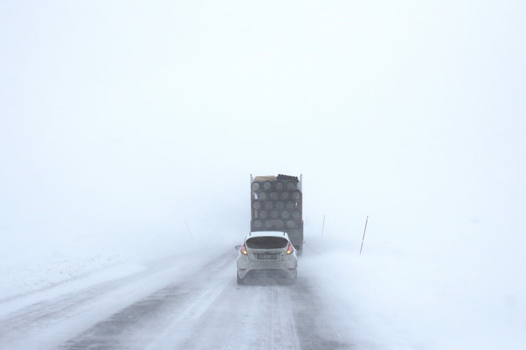 a car driving in the snow