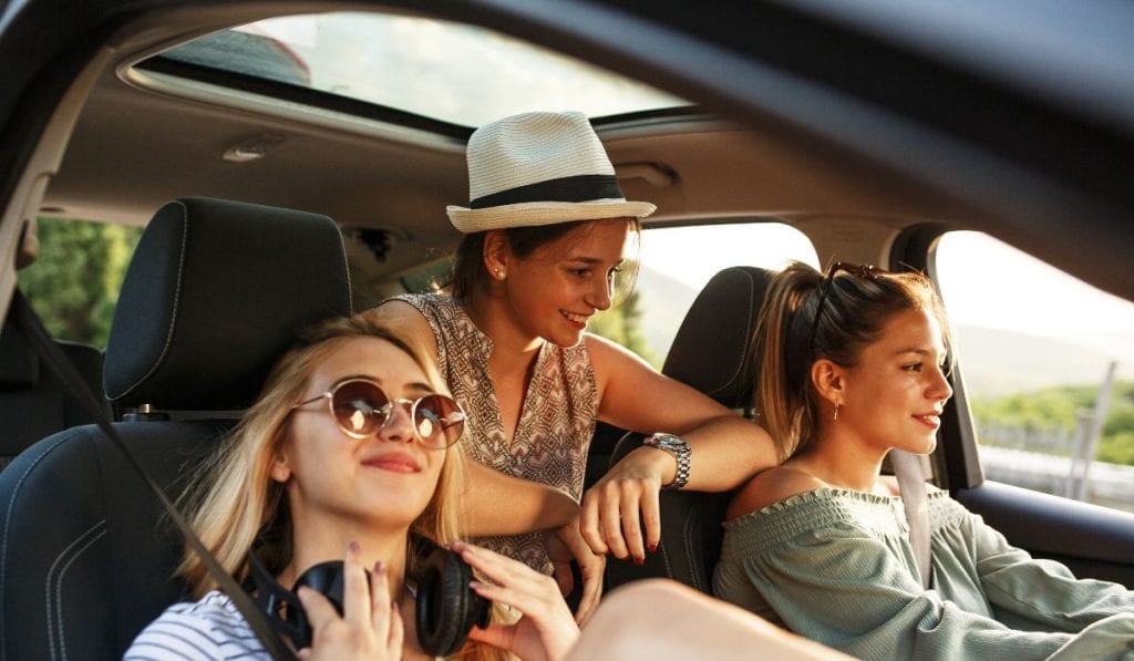 Students on road trip in car