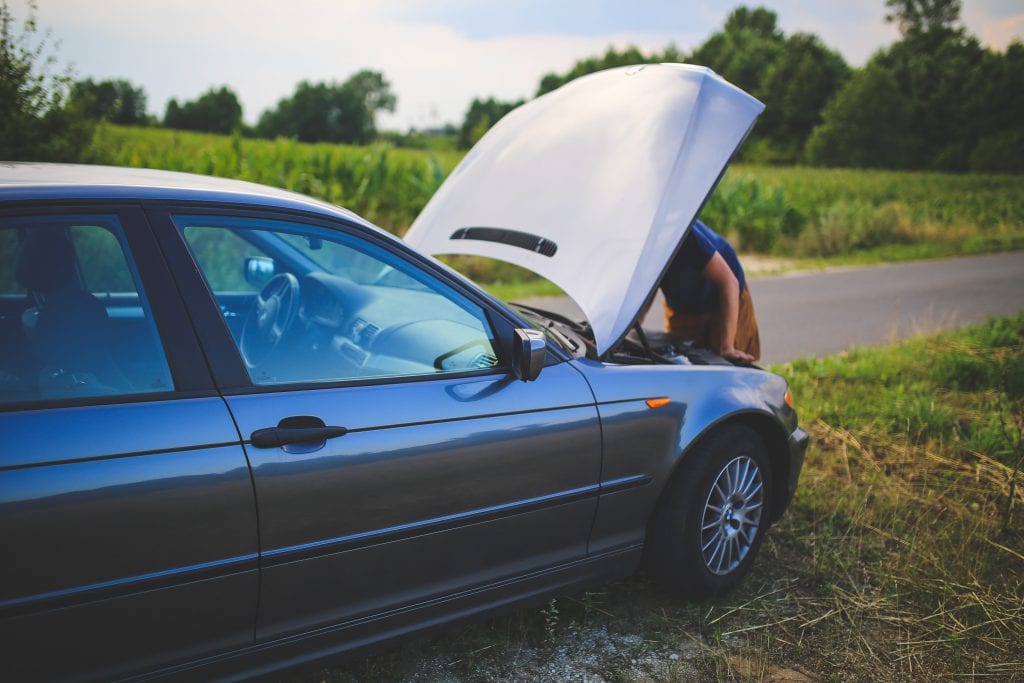 Repairing car on roadside