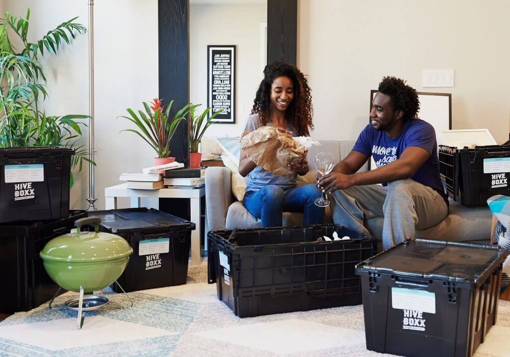 Young couple packing up belongings