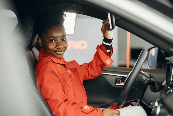 Learner driver smiling in car