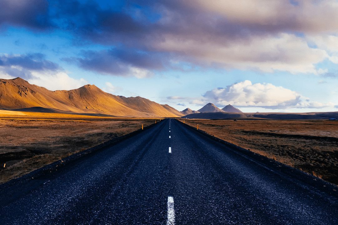 a road with a sunset