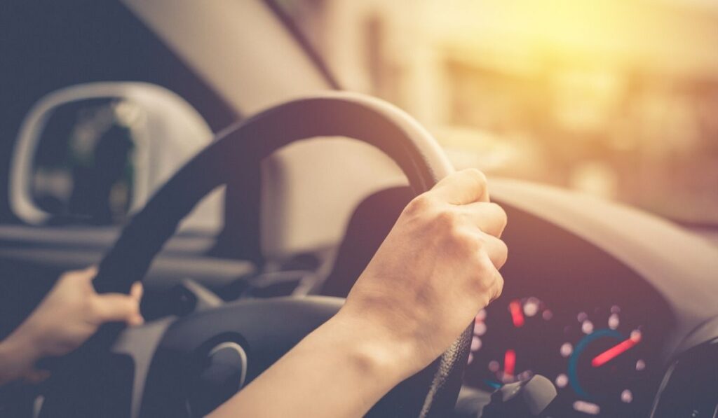 Temporary driver with hands on steering wheel