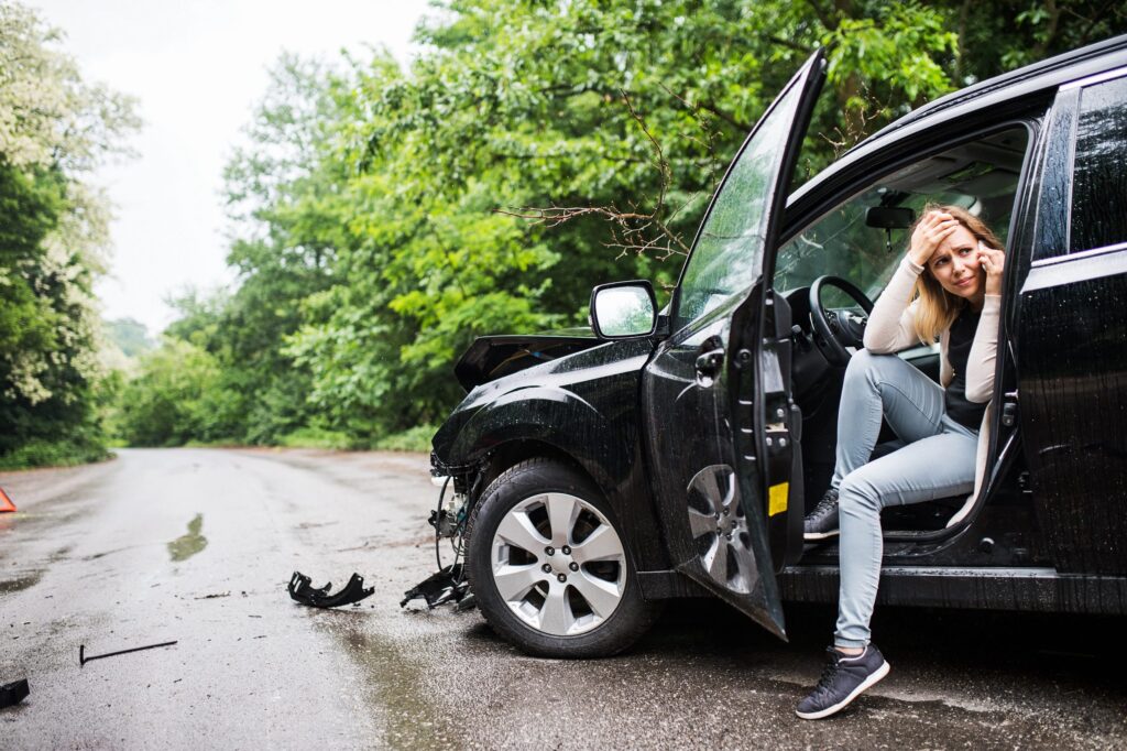 Young women making phone call after hit and run