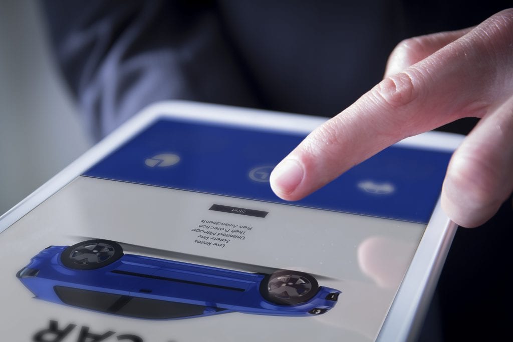 Looking at car specs on tablet