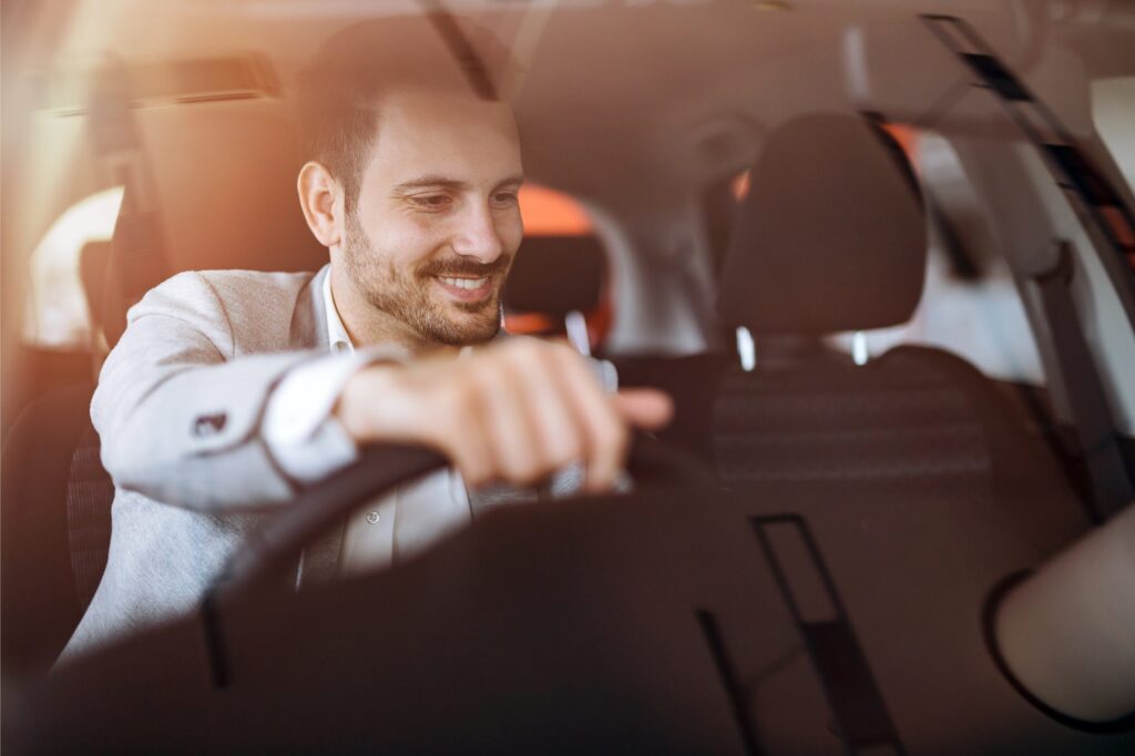 Man behind the wheel of a car