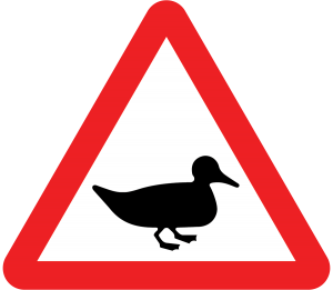 ducks or wild fowl likely in the road sign