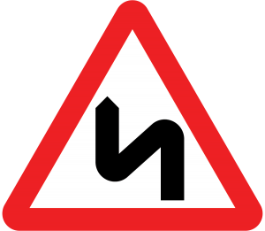 double bend in the road sign